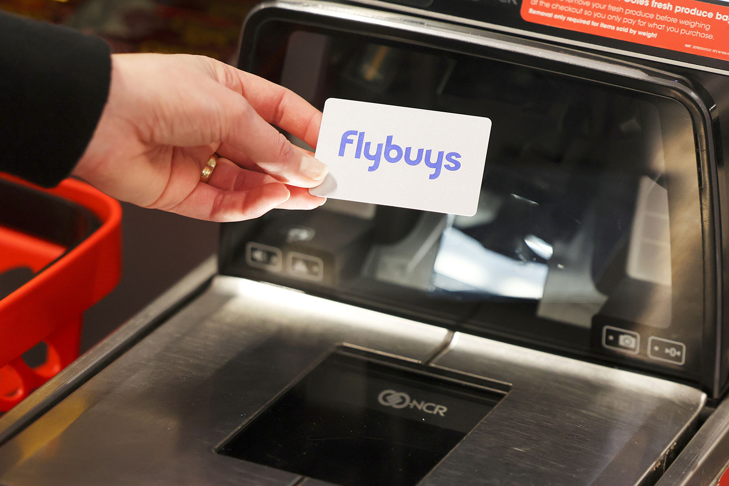 Flybuys card scanning at Coles self-checkout machine