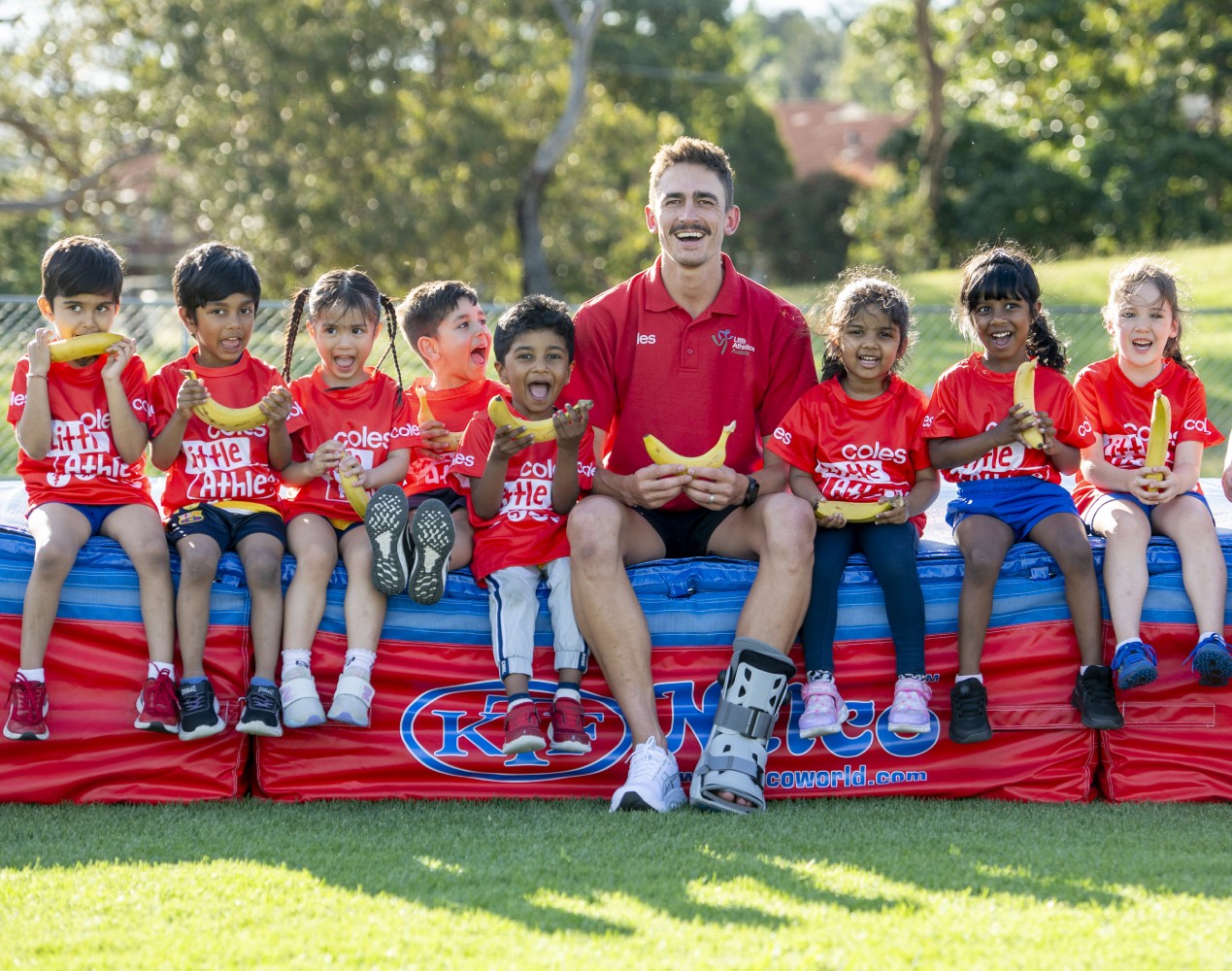 Brandon Starc with Tiny Tots for the Coles Banana A-Peel launch