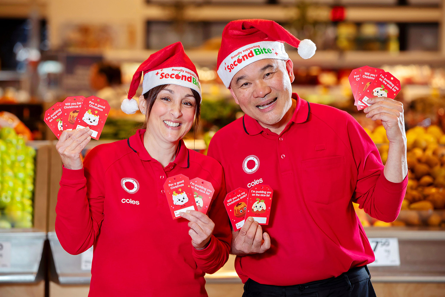 Coles team members Michelle and Rui with the $2 SecondBite Charity Gift Tags