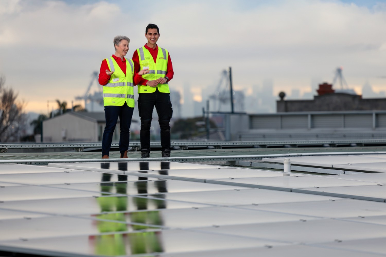 Jane Mansfield, Head of Energy at Coles, and Nabin, Coles Team Member, during a photo shoot for solar panels at Coles Williamstown store in Melbourne on August 8th, 2025. Photo by Martin KEEP Coles.
