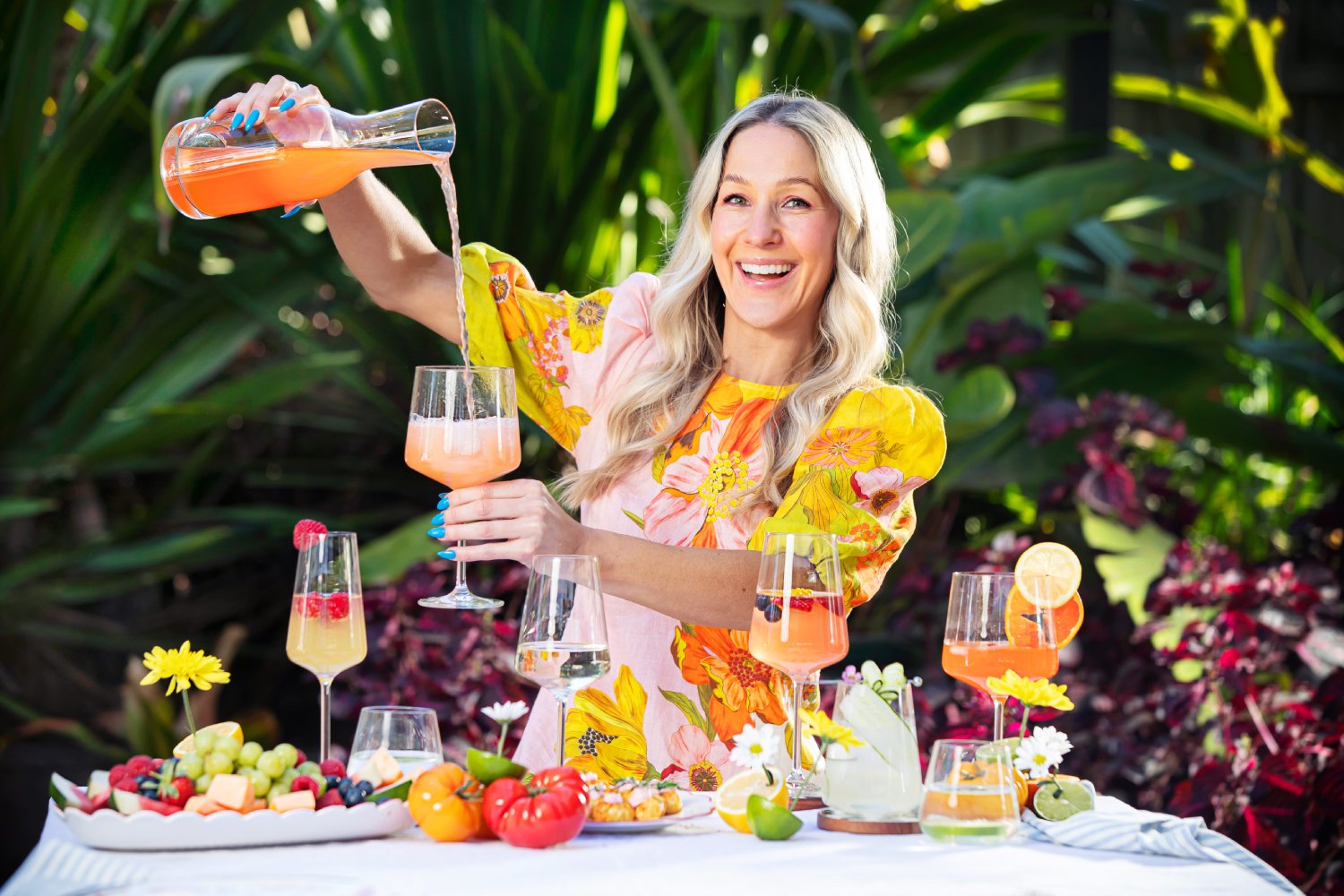 Image of a lady pouring a drink in a glass