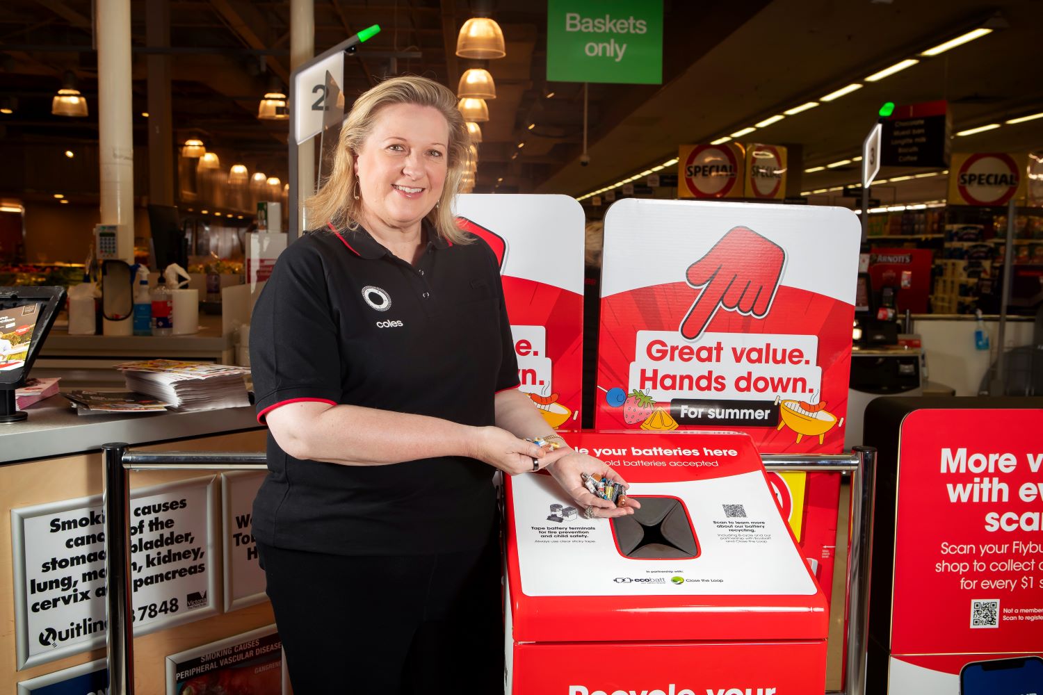 Coles General Manager of Sustainability Brooke Donnelly with a new battery recycling bin