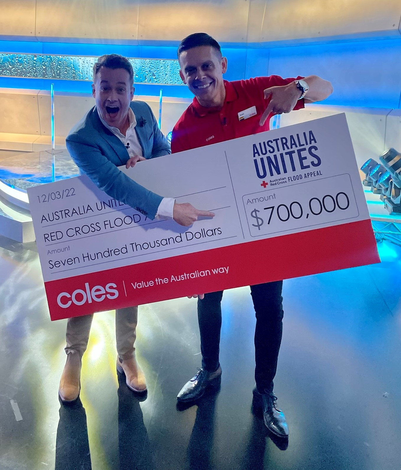 TV presenter Grant Denyer and Coles NSW General Manager Ivan Slunjski with $700,000 donation to Red Cross Flood Appeal