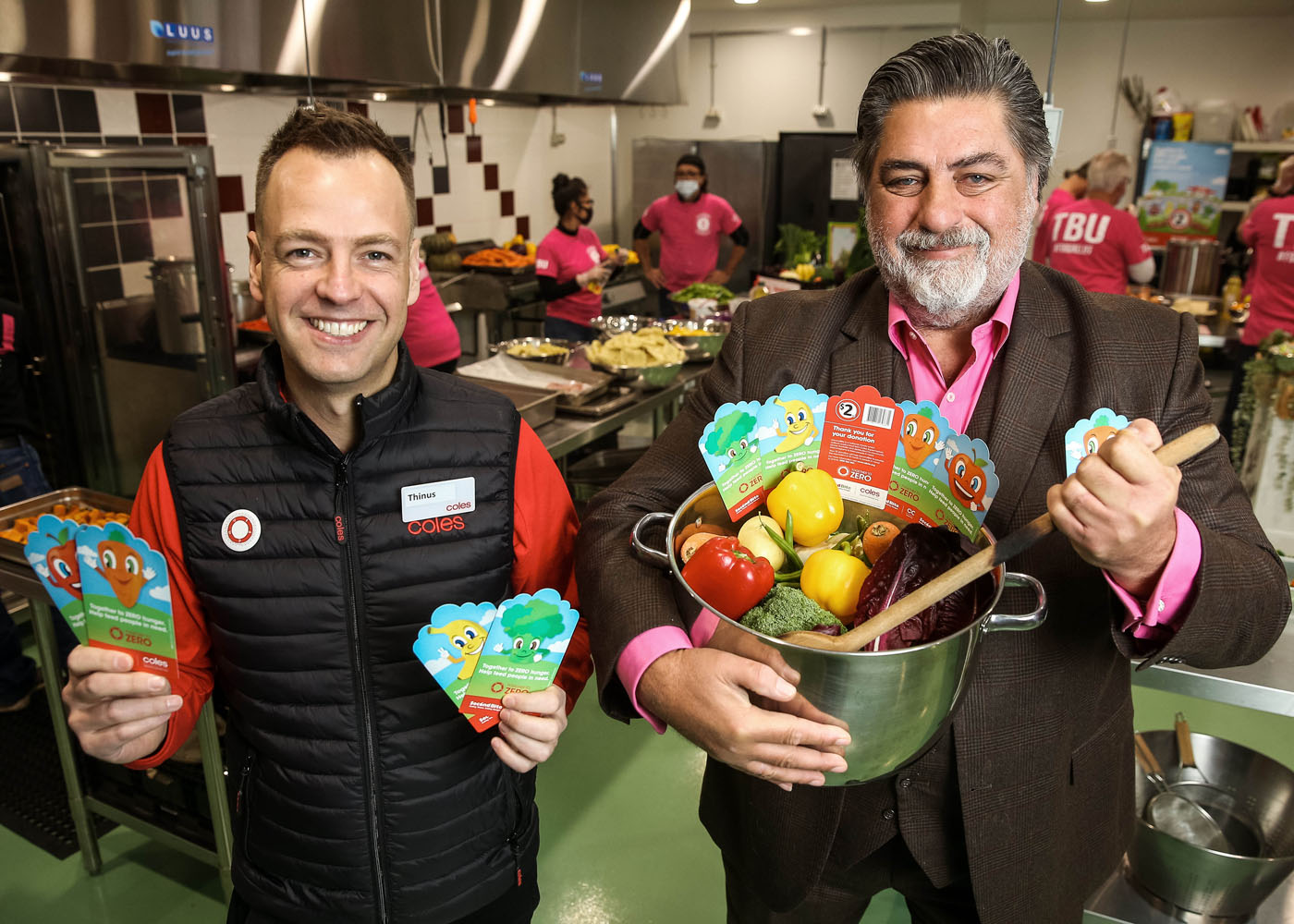 Coles' Thinus Keeve and Matt Preston with Coles SecondBite Winter Appeal cards
