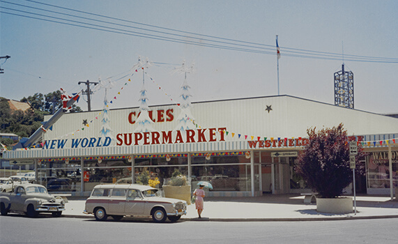 1960 - 1969 - Coles employees in standing behind cashier