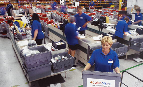 1990 - 1999 - Coles employees in blue uniform sorting items