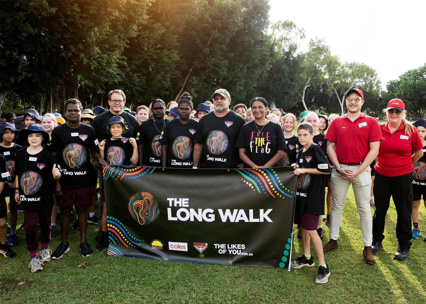 Students from Jingili Primary School take a Little Long Walk with Michael Long, Nova Peris and Coles Store Managers Daniel  Gobbo and Debbie Huxley