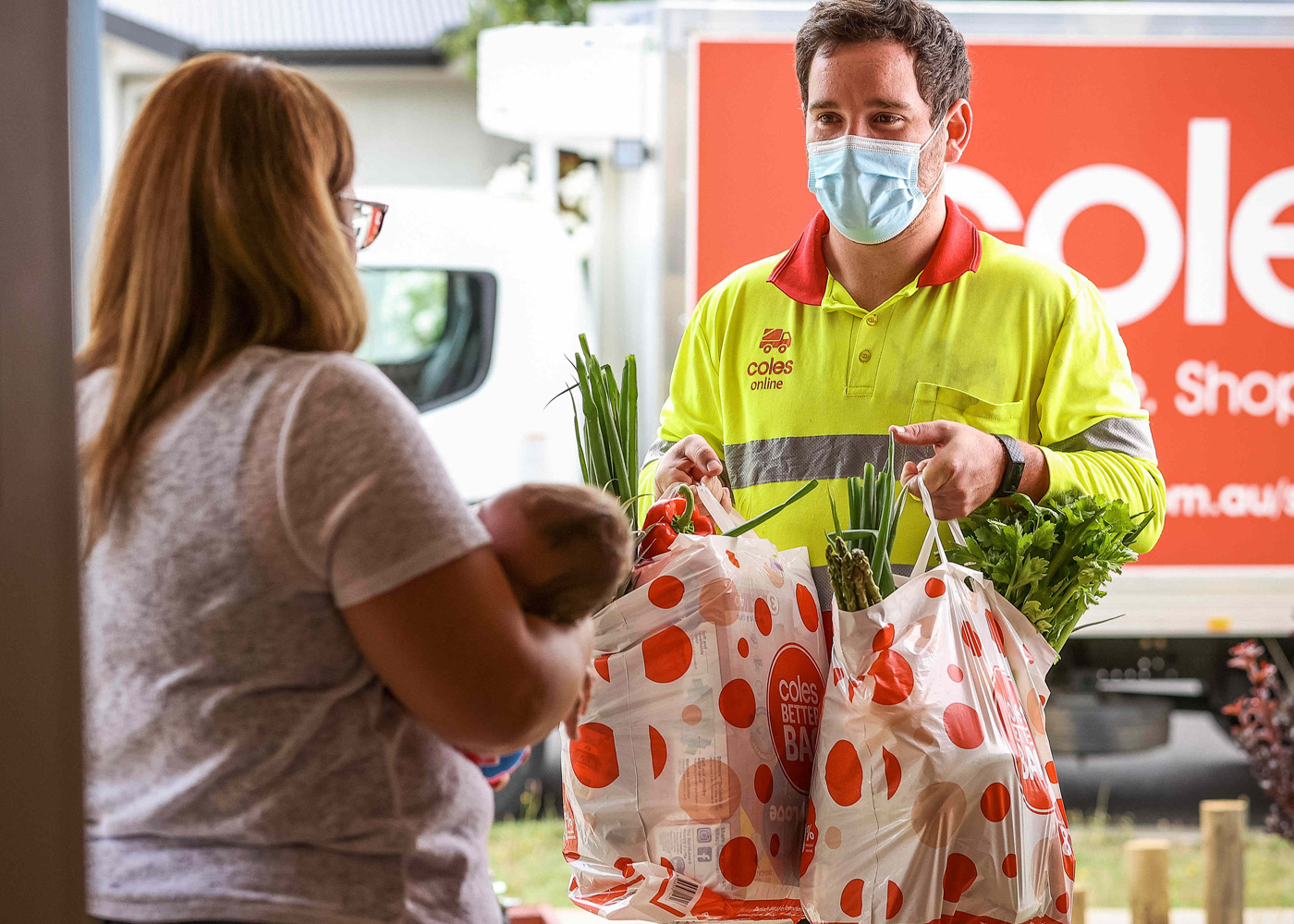 Bacchus Marsh CSA Daniel drops off home delivery to customer Cass and baby Ella