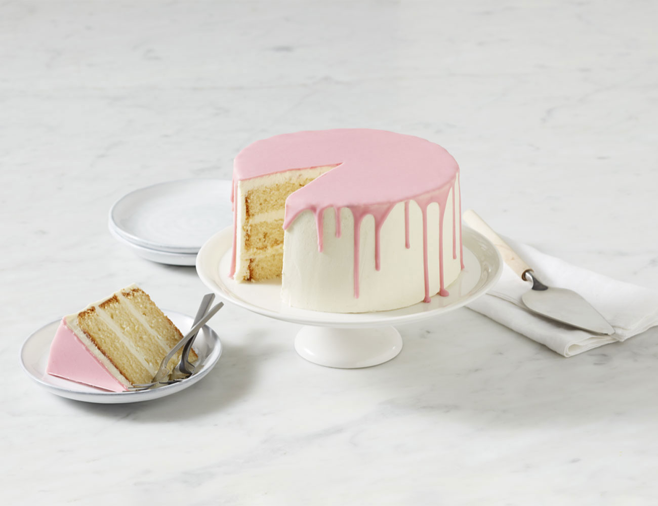 Coles Pink Vanilla Drip Cake