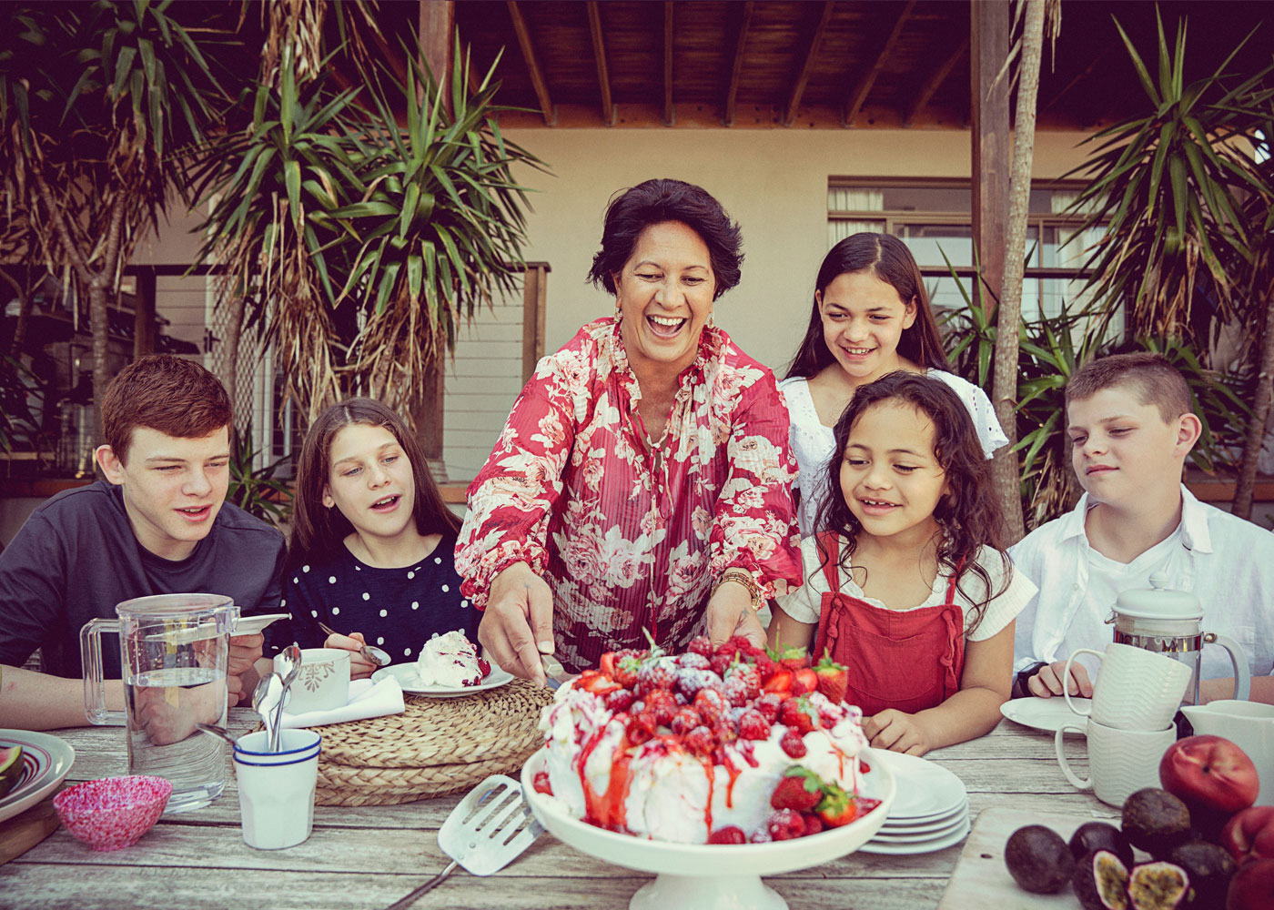 Family eating pavlova