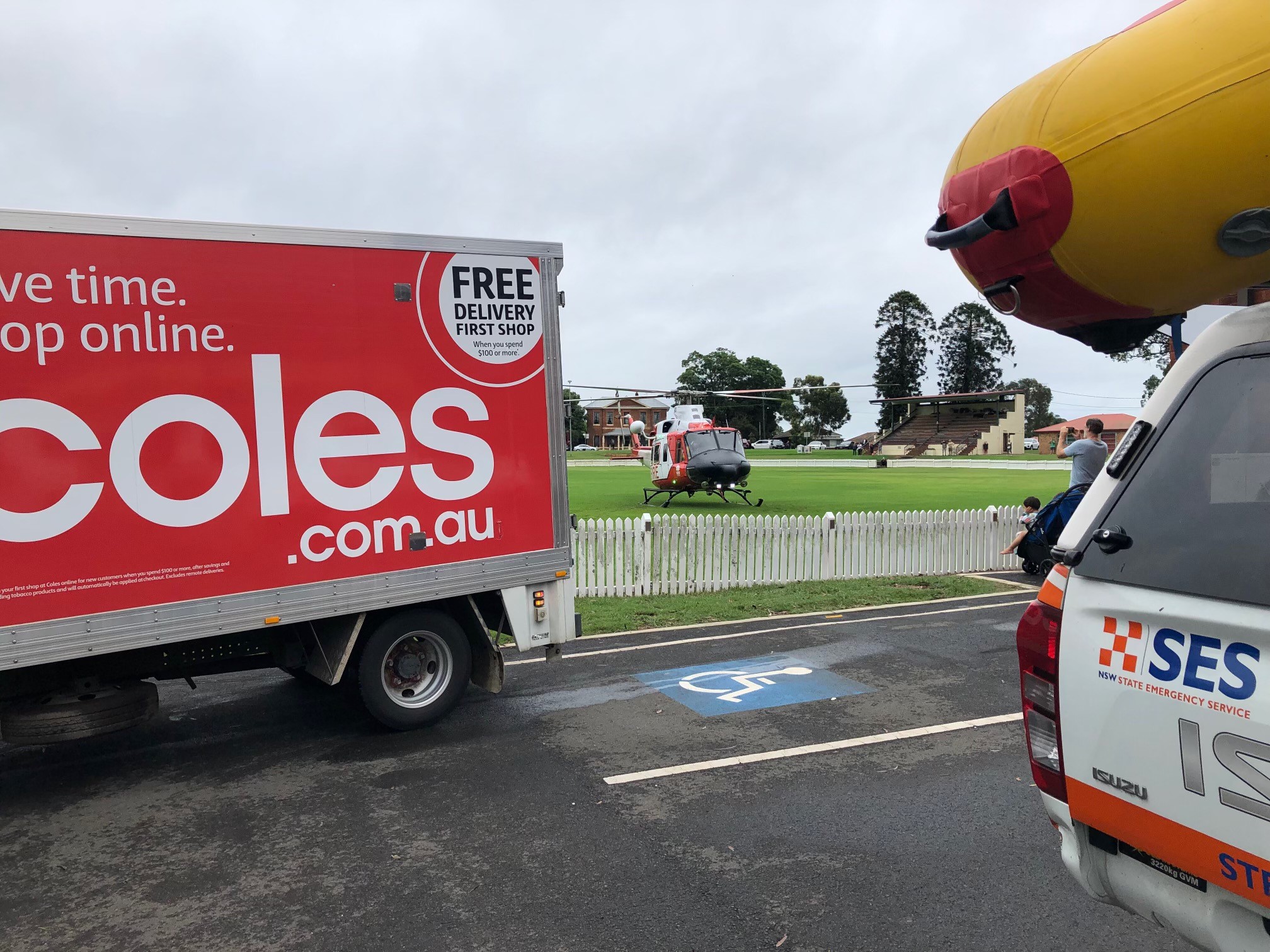 Helicopter picking up Coles supplies for flood victims