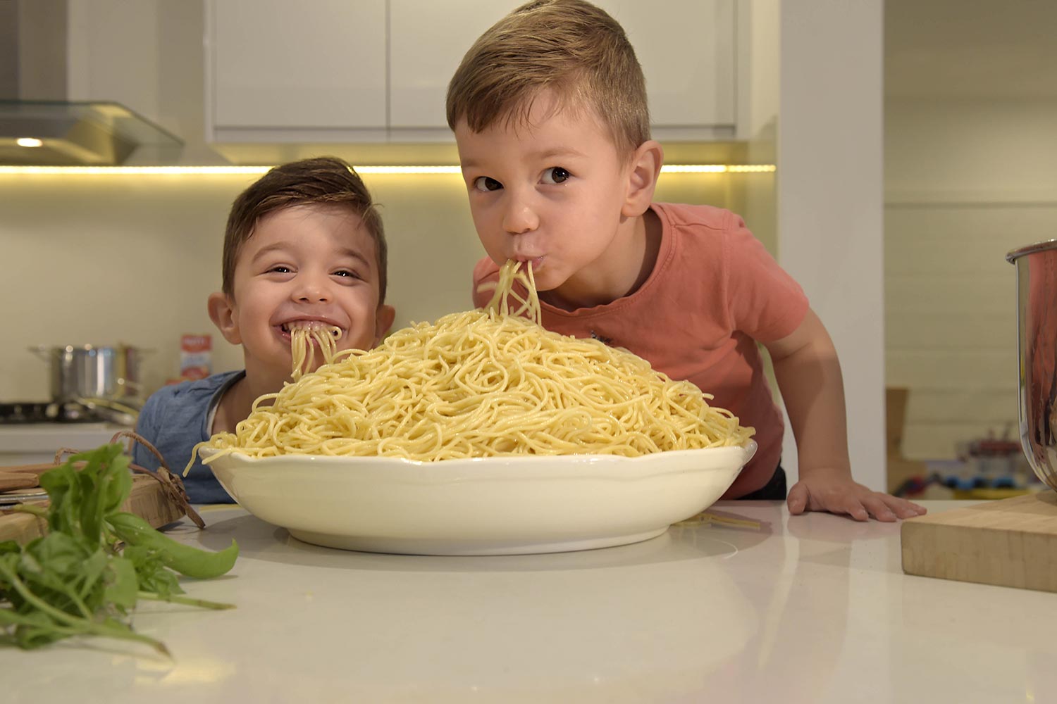 Twins Jack (left) and Anthony (right) Piccone enjoy the Barilla spaghetti available in bulk in the Big Pack Value sale.