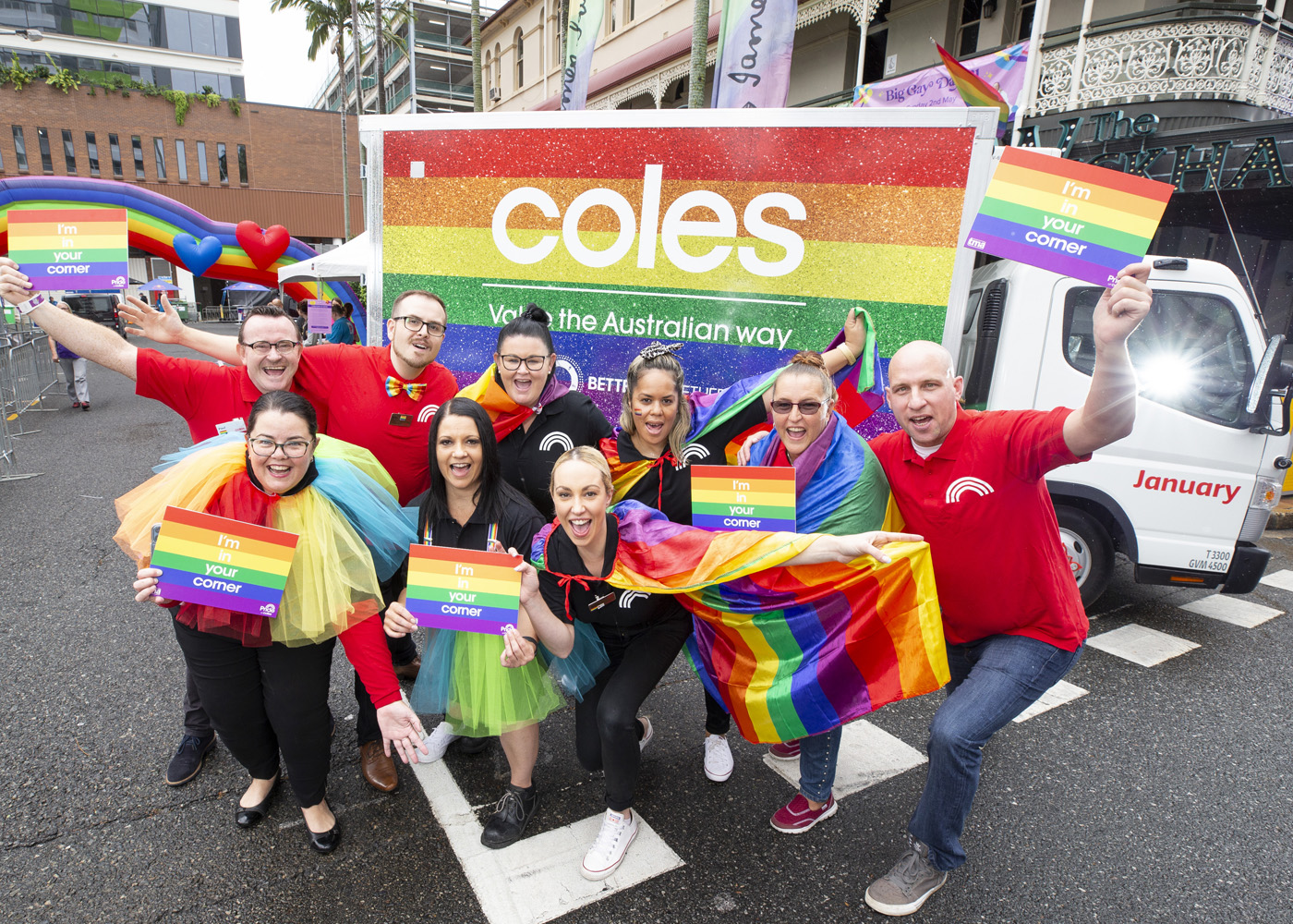 Coles team members with the pride-themed delivery truck on Big Gay Day 