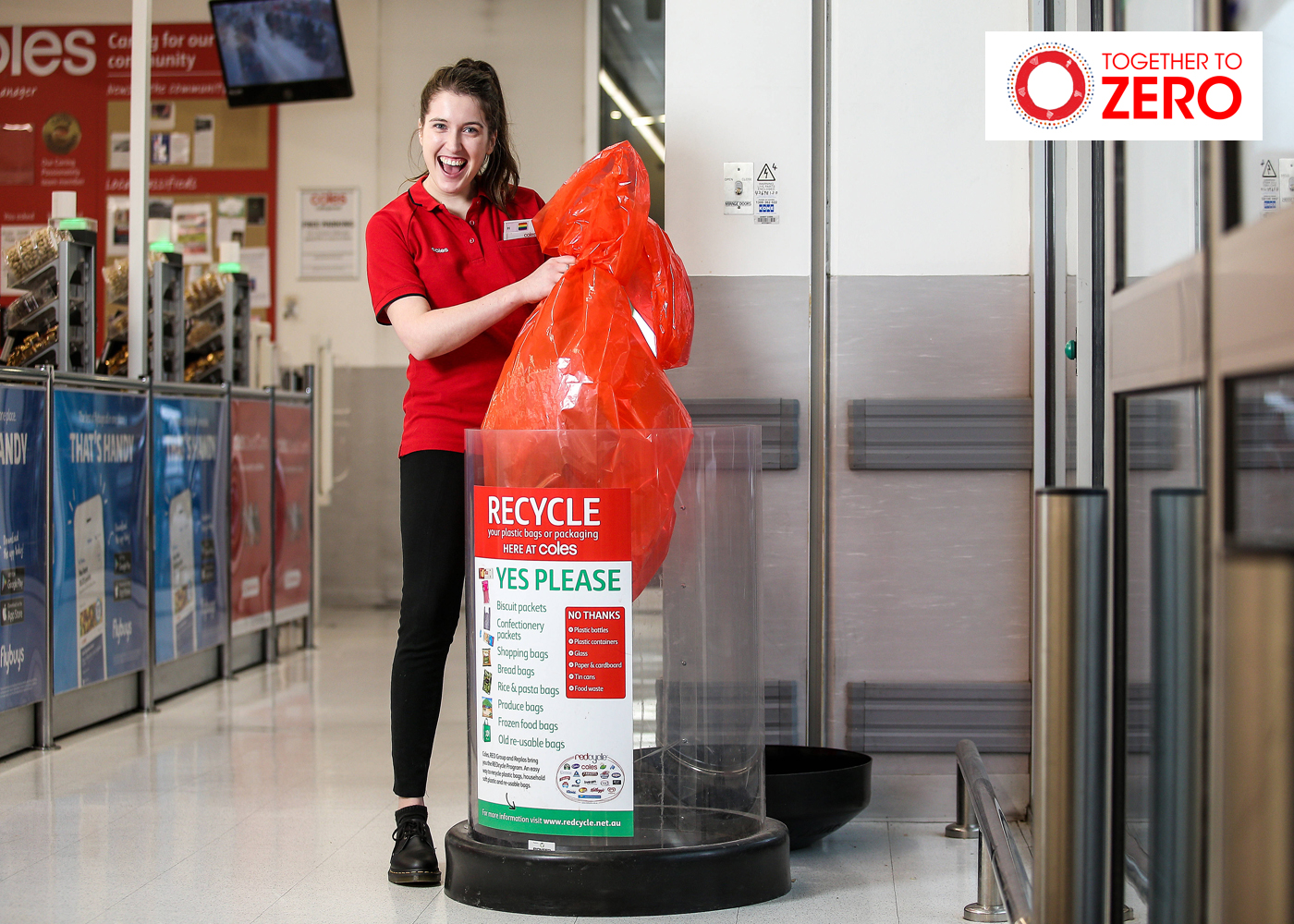 Coles team member disposing of soft plastics in Redcycle bin 